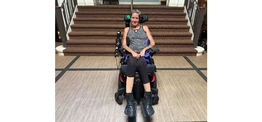 Jean in her power wheelchair with switch-it vigo