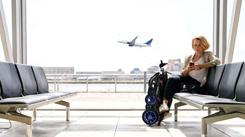 Woman at airport waiting for flight